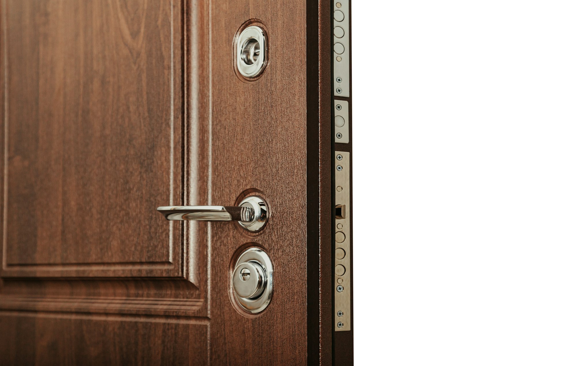 Close-up of open modern steel armor door with chrome metal handle and lock